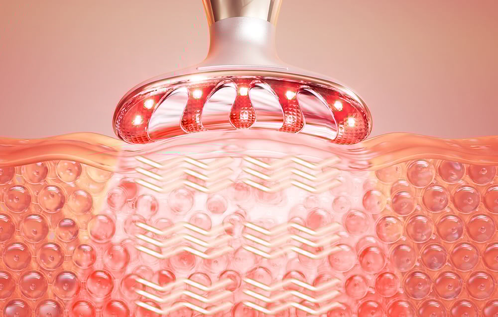 Gros plan de la tête de l'appareil émettant de la lumière LED rouge agissant sur les couches de la peau