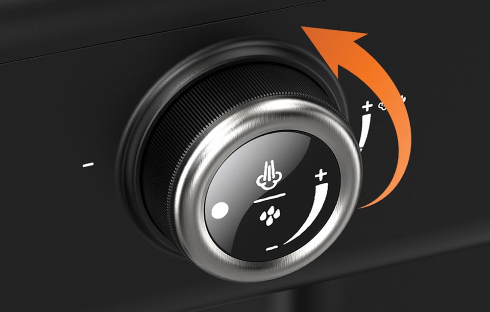 Gros plan du bouton de contrôle latéral de la machine à espresso, utilisé pour réguler l'émission de vapeur et d'eau chaude.